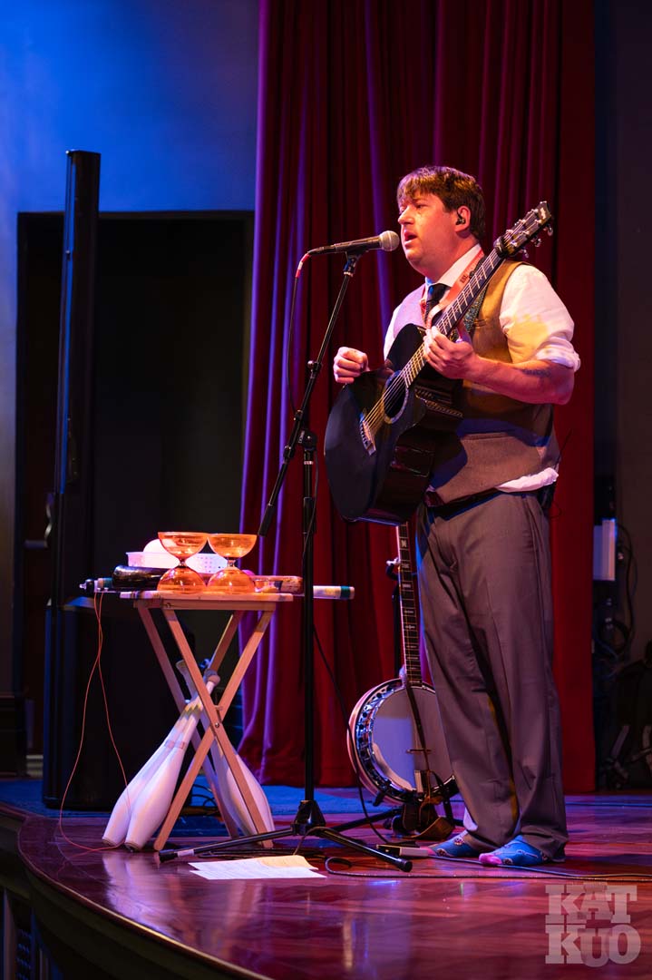 Brian Tomaszewski playing guitar at the 2025 ESL Rochester Fringe Festival.